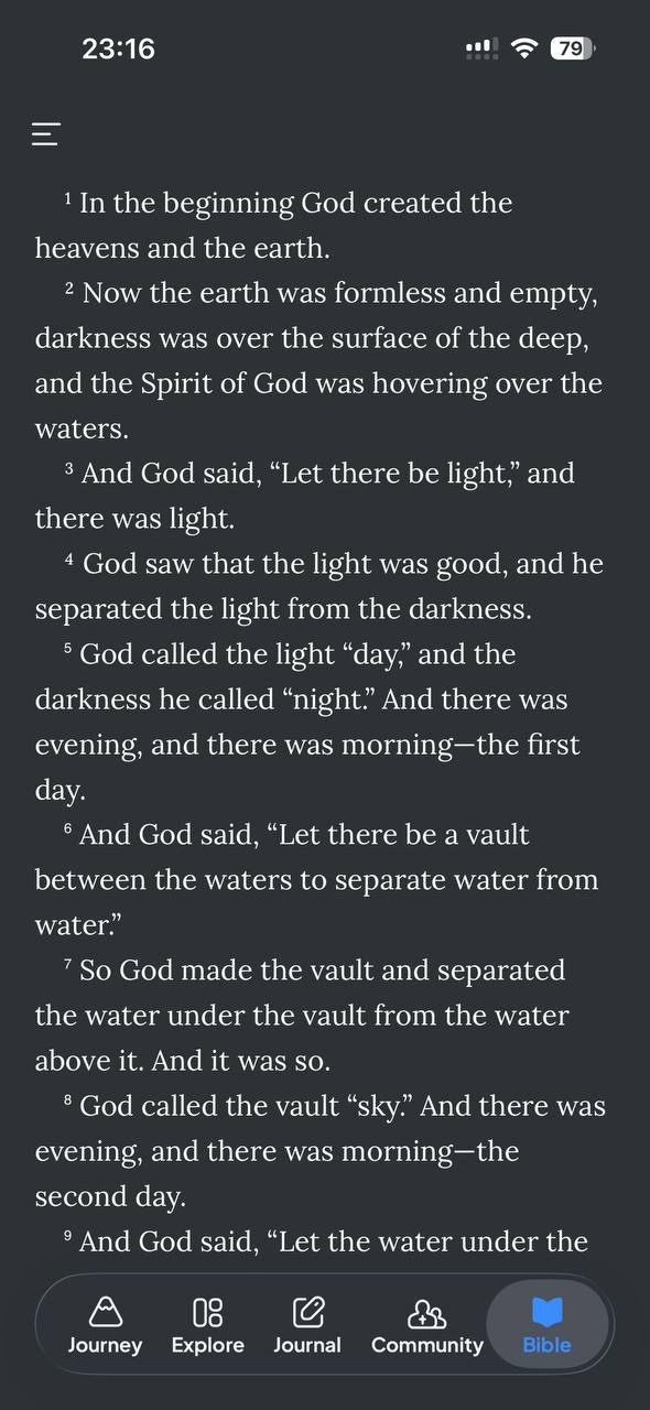 Bible reader showing Genesis chapter one